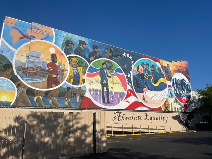 The "Absolute Equality" mural was painted last year by artist Reginald Adams to commemorate and celebrate the Juneteenth holiday that originated in Galveston. The location marks where the Osterman Building, an important historical location related to the holiday, once stood. 